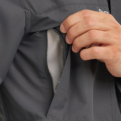 Close-up of mesh-lined zippered vent pocket on dark gray outdoor performance shirt.