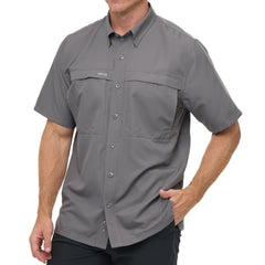 Man wearing GunMetal gray GameGuard Original short sleeve shirt with chest vents and GG logos; breathable, quick-dry performance for outdoor wear.
