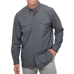 Man wearing Caviar GameGuard Pearl Snap Shirt with long sleeves, flap chest pockets, snap closures, and western yoke; classic rugged style for ranch or town.